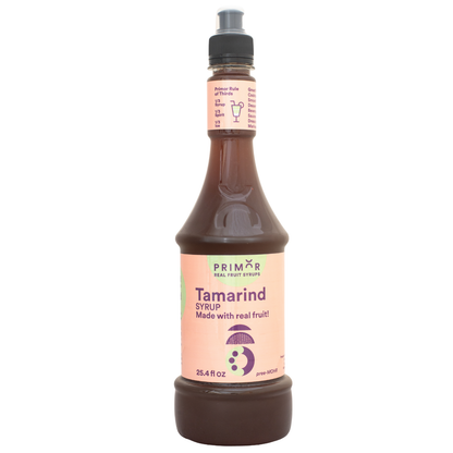 Bottle of Primor Tamarind syrup with a pink label on a white background